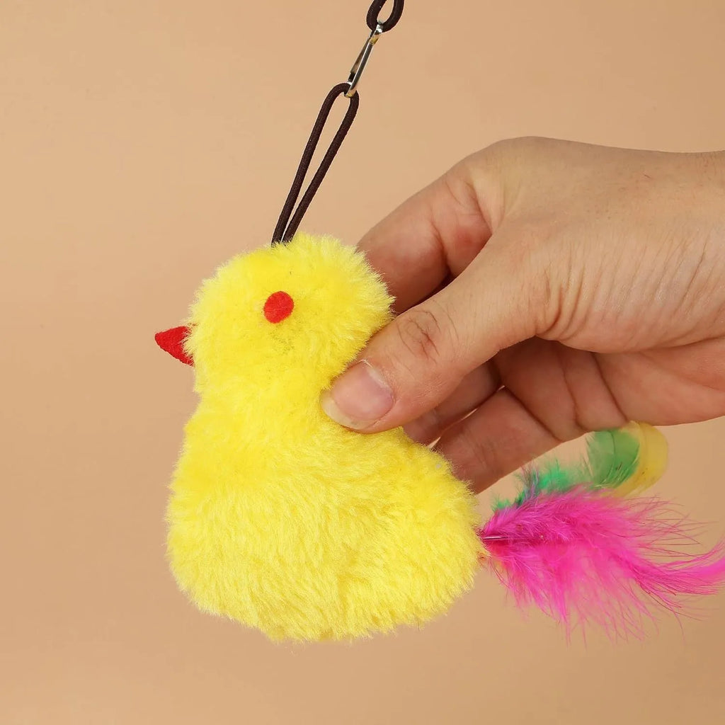 Interactive cat toy hanging from door frame with dangling mouse and chicken toys on elastic rope