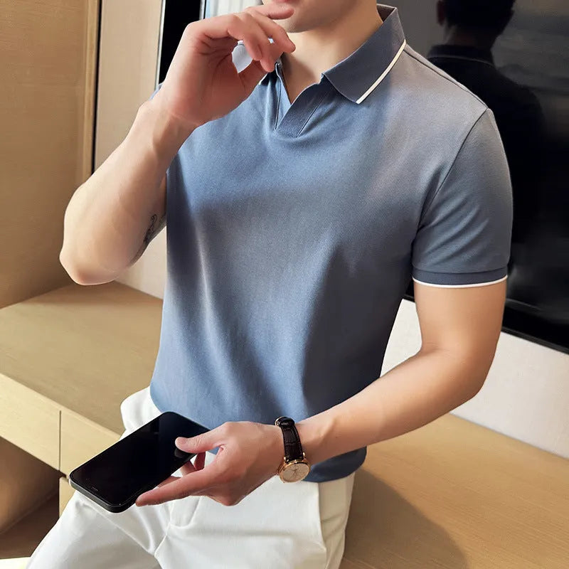 Mens solid colour lapel polo shirt in a cotton blend fabric on a hanger
