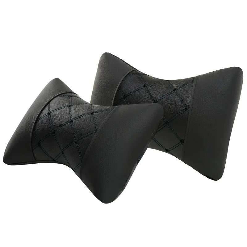 Black leather quilted car headrest neck pillow with diamond pattern and contrast stitching.