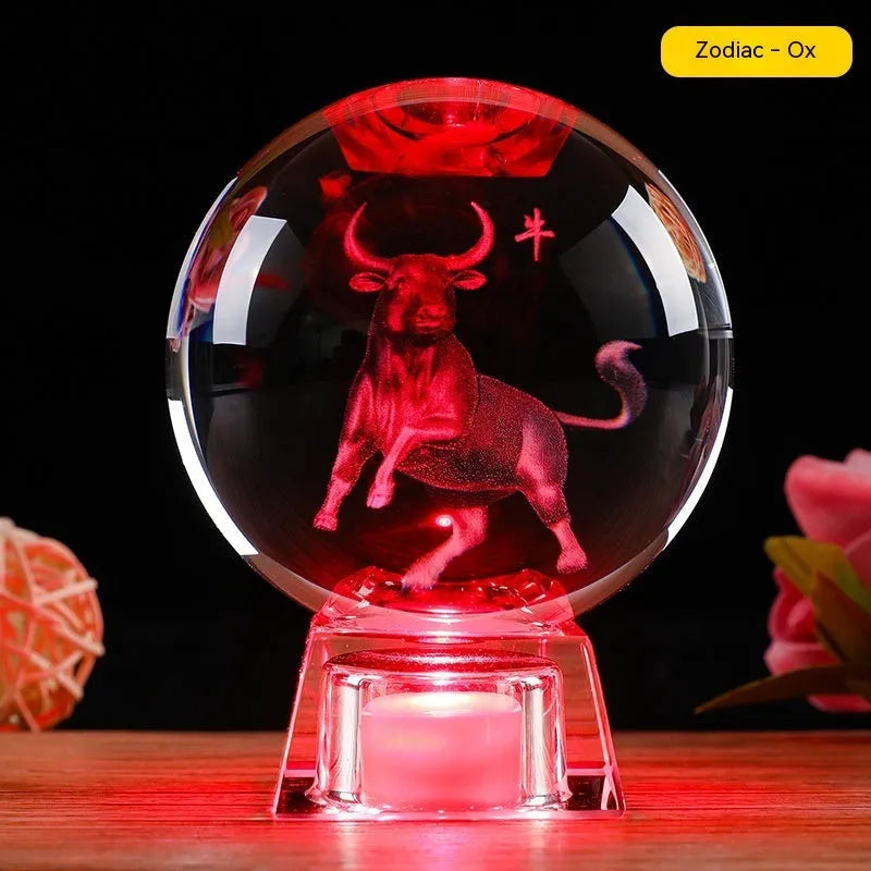 White crystal zodiac decorative ball with electronic base lighting showing Chinese-style animal design