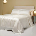 Luxury Lenzing Tencel quilt cover and pillowcase set in a modern style, showing colour options like Aurora Blue.