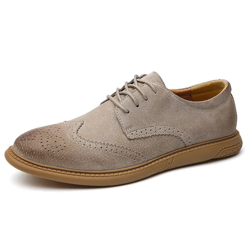 Men's black leather low-top lace-up business shoes with a rubber sole on a plain background.