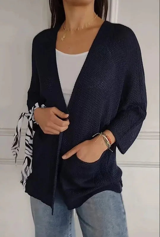 Women's army green waffle weave cardigan coat with nine-quarter length sleeves and pockets.