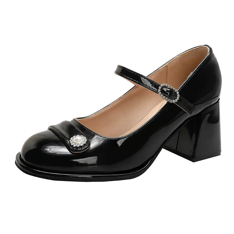 Women's apricot patent leather high heels with a round toe and chunky heel, shown with a buckle fastening.