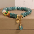 Blue water jade abacus bead bracelet with white agate and butterfly charm design