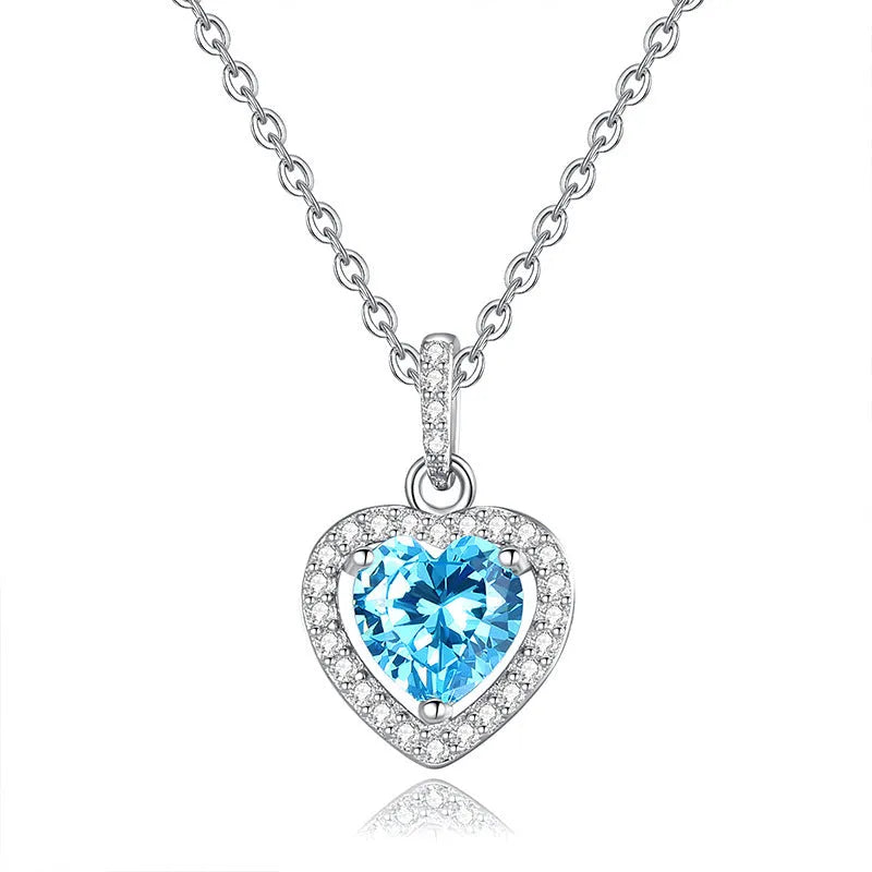 Sterling silver heart pendant necklace with a natural coloured gemstone on an adjustable cross chain.