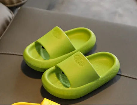 Children's bright coloured EVA slippers with non-slip soles in blue, green, orange, pink, and yellow.