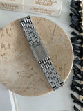 Women's antique-style bracelet watch with butterfly clasp in silver or gold with white or grey dial faces