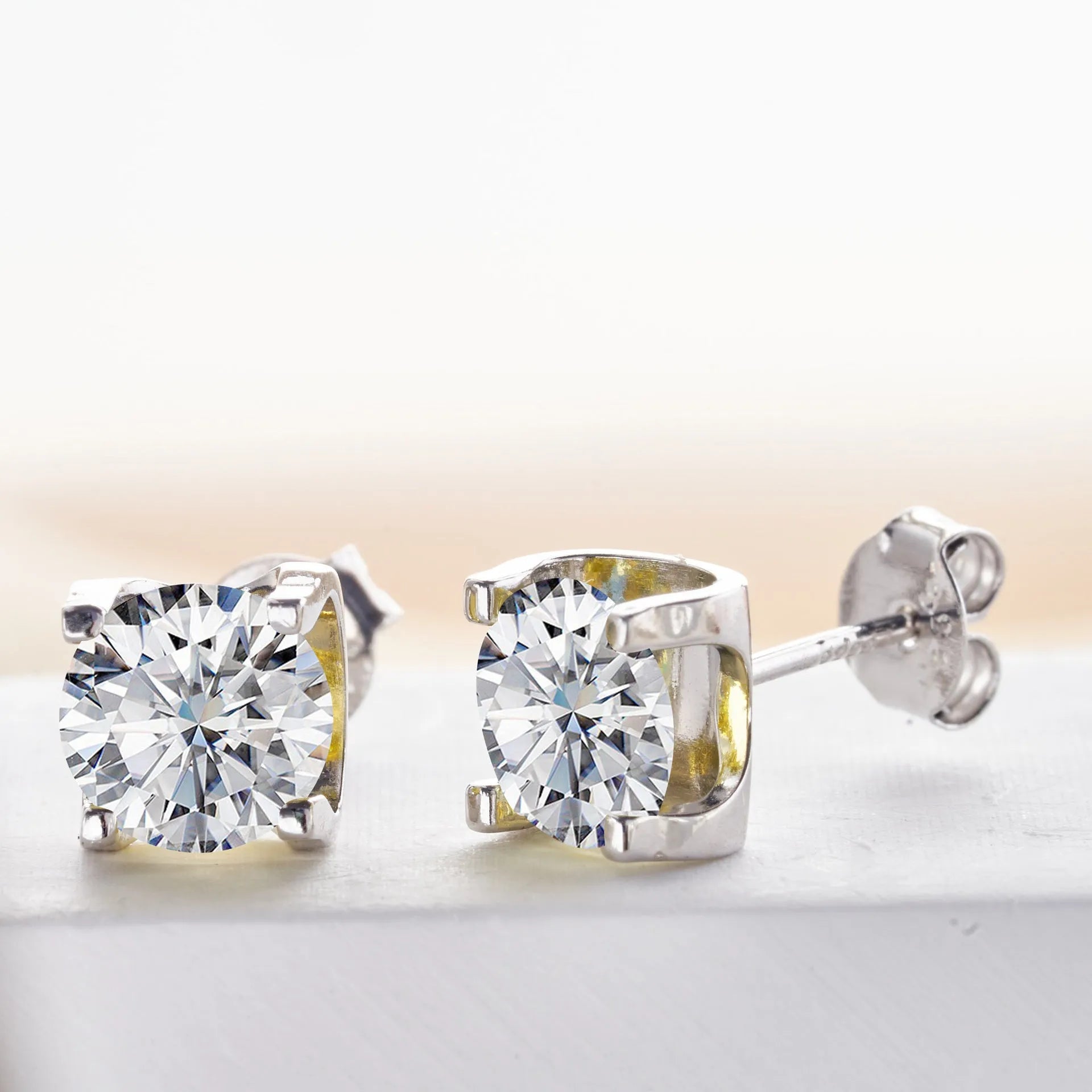 Micro inlaid moissanite stud earrings in S925 sterling silver with round natural stones, unisex design, 1CT per pair