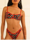 Women's cherry print floral polyester bikini swimsuit set with tube top and briefs.