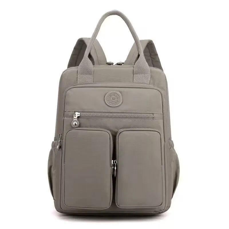 Women's waterproof nylon travel backpack with multiple internal compartments in various colours
