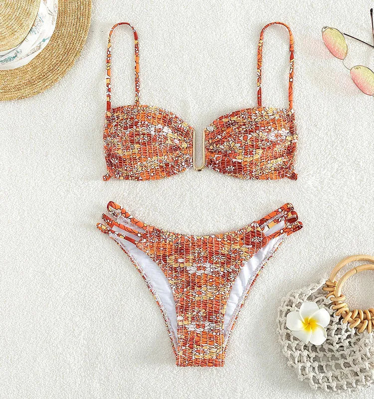 Women's orange high-waisted floral bikini swimsuit with matching bra