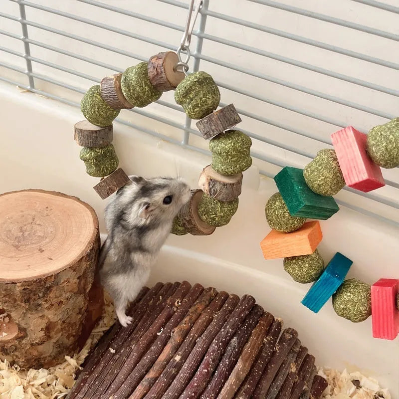 Hamster chew toy with colourful straw balls on ring and applewood molar rod