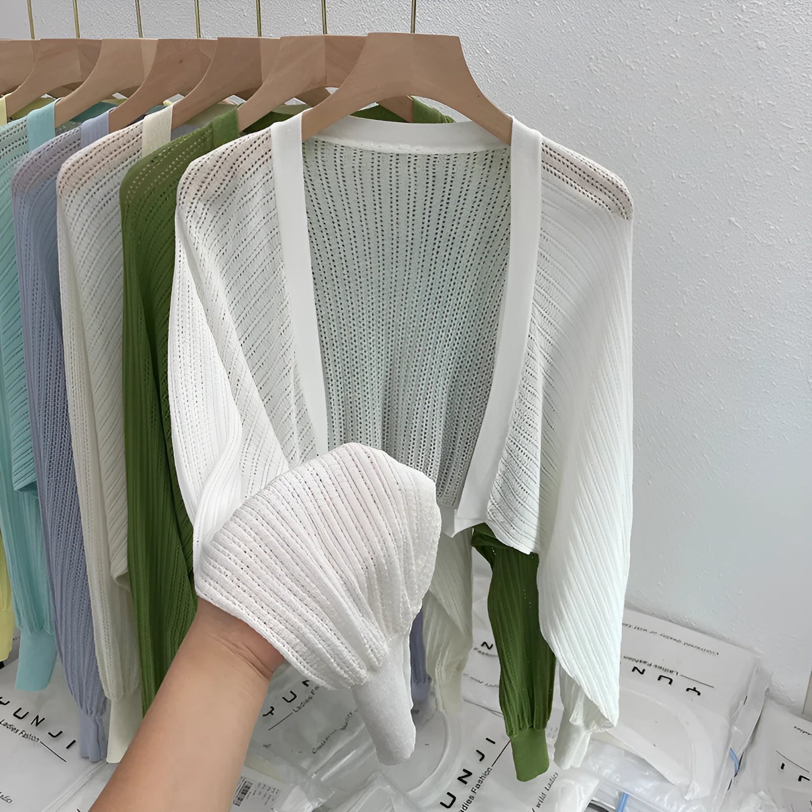 Women's linen blouse with hollow-out design and long lantern sleeves in apricot colour