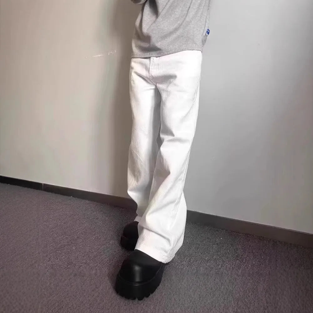 Men's white straight-leg wide-leg cotton denim jeans on a plain background.