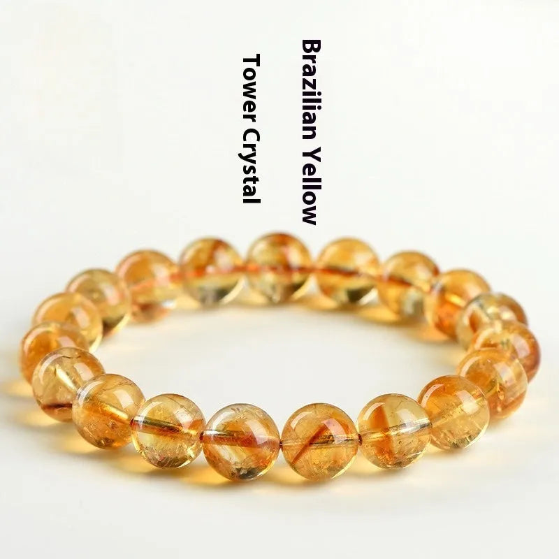 Natural yellow Asestelle citrine bracelet with hand-ground geometry beads on a wrist.
