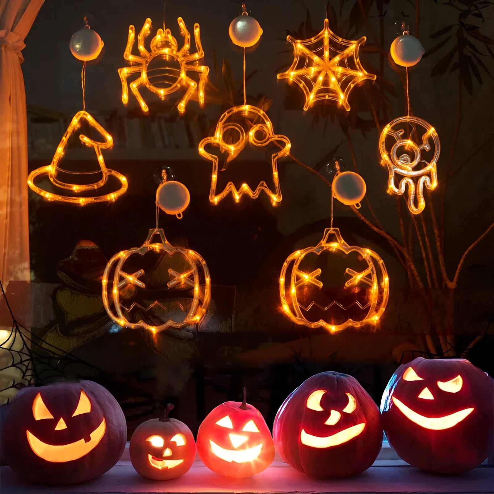 Seven Halloween LED window lights with spider, pumpkin and ghost designs on suction cups