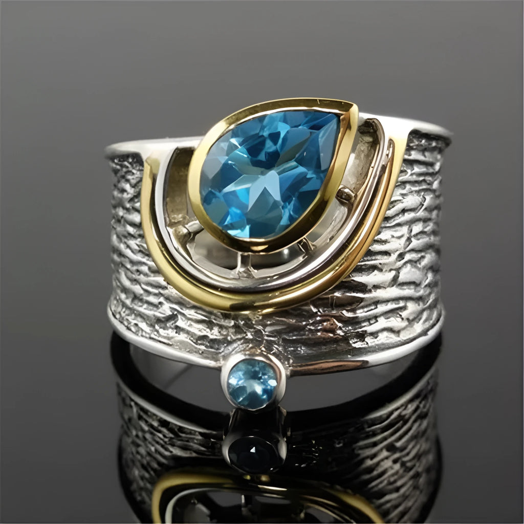 Blue zircon Chinese style women's ring with drop shape design and alloy construction