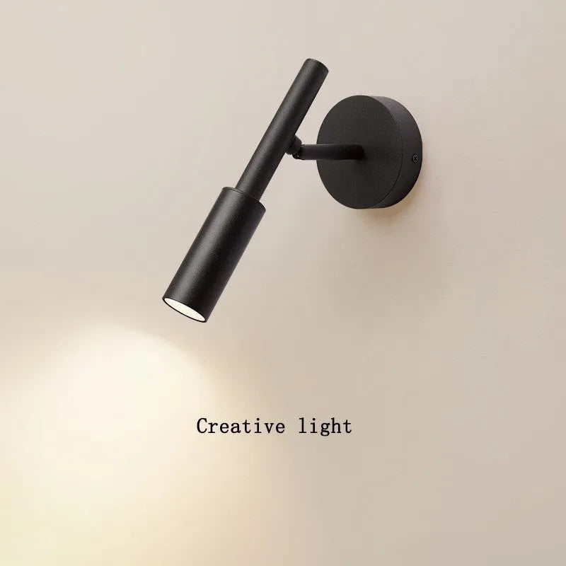 Modern minimalist wrought iron wall lamp in black or white with adjustable three-colour lighting.
