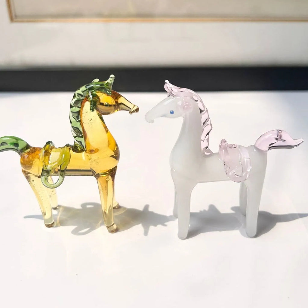Brown glazed ceramic horse ornament on wooden shelf