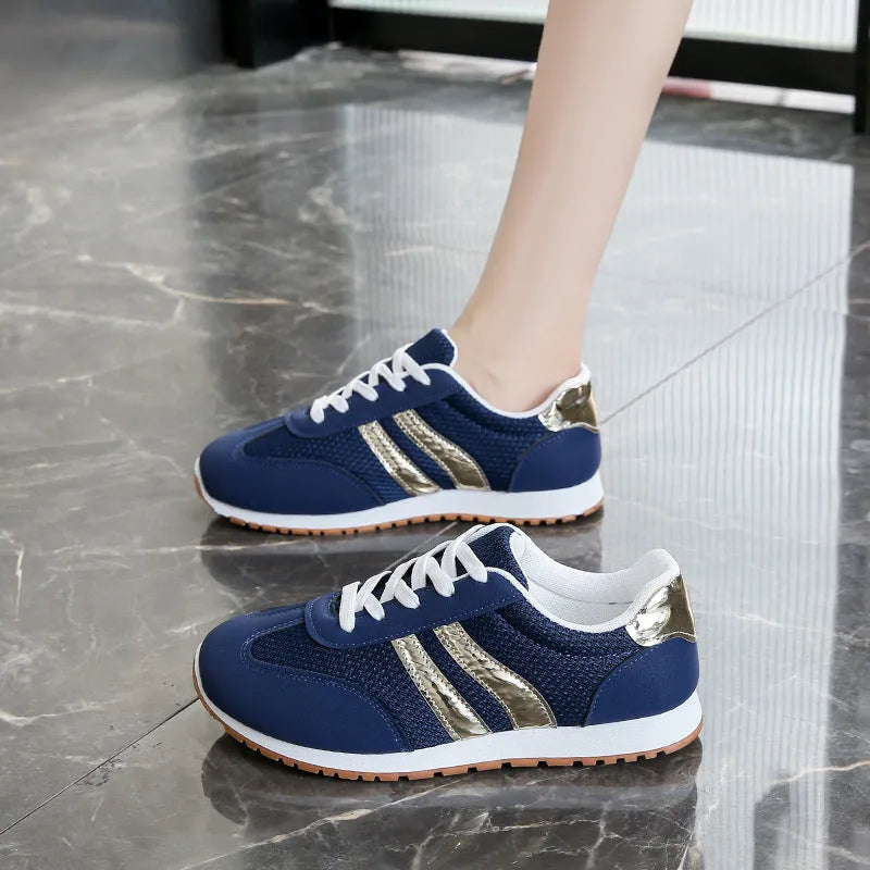 Blue women's casual sports shoes with cross shoulder straps and white rubber sole, shown on a size label.