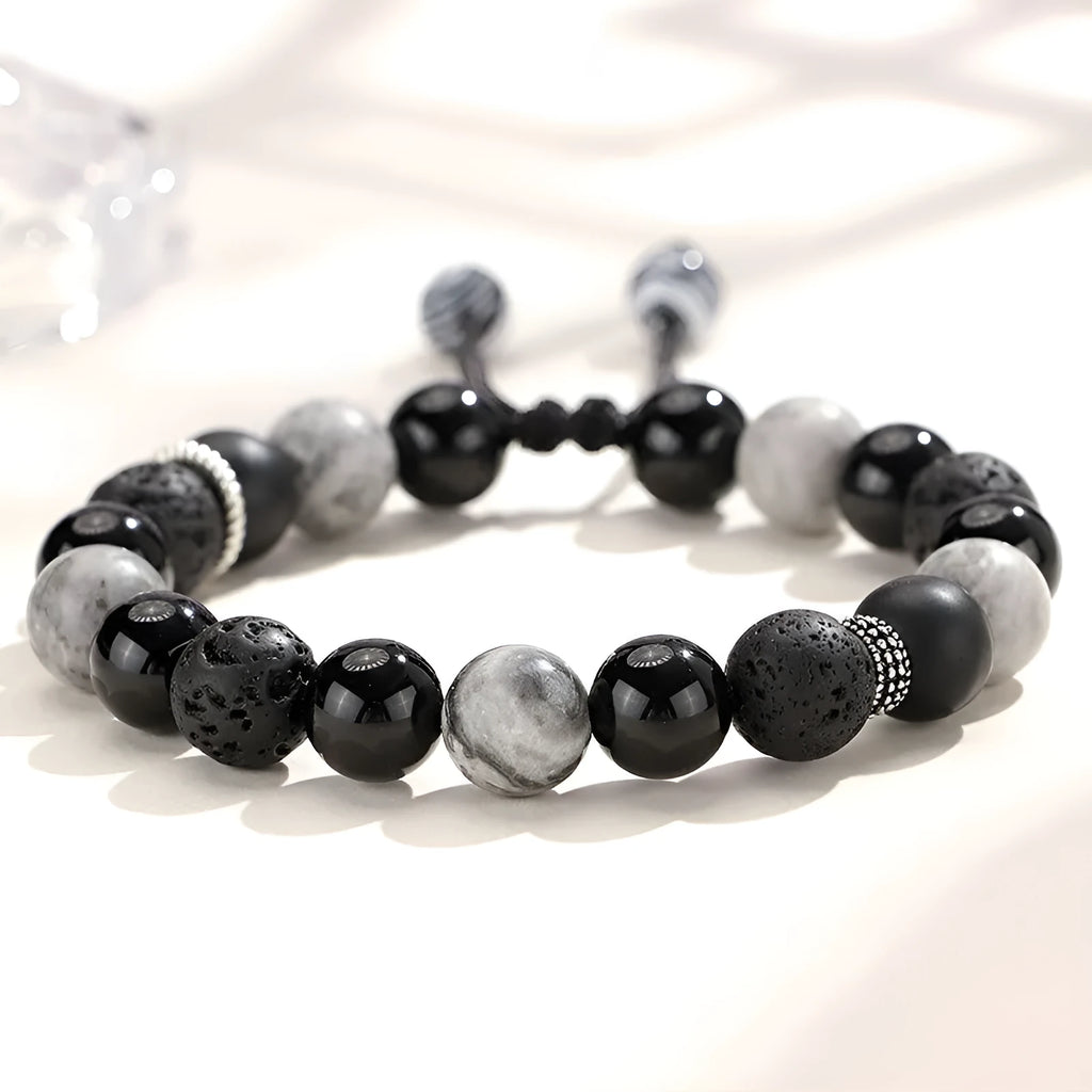 Black agate map stone volcanic rock bracelet in diamond shape, New Chinese style, on wrist.