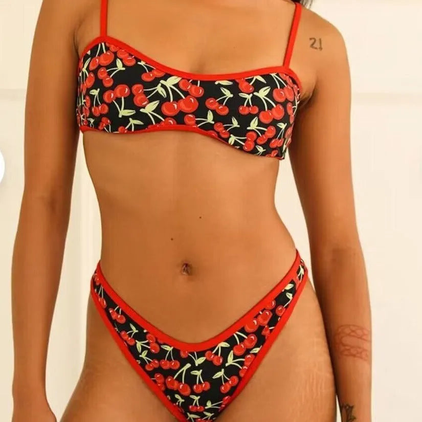 Women's cherry print floral polyester bikini swimsuit set with tube top and briefs.