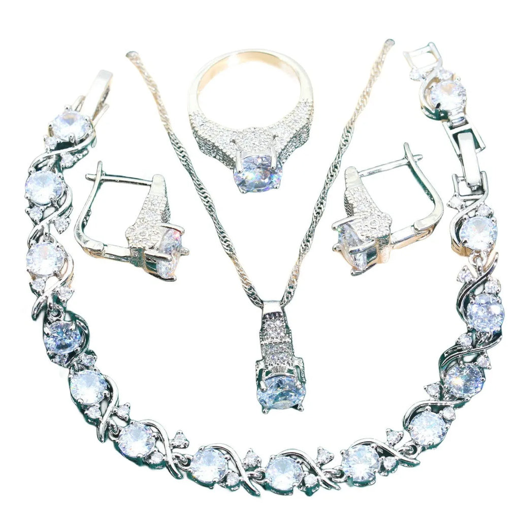 Bridal zircon four-piece jewellery set showing necklace, bracelet, earrings and ring with alloy pendant material
