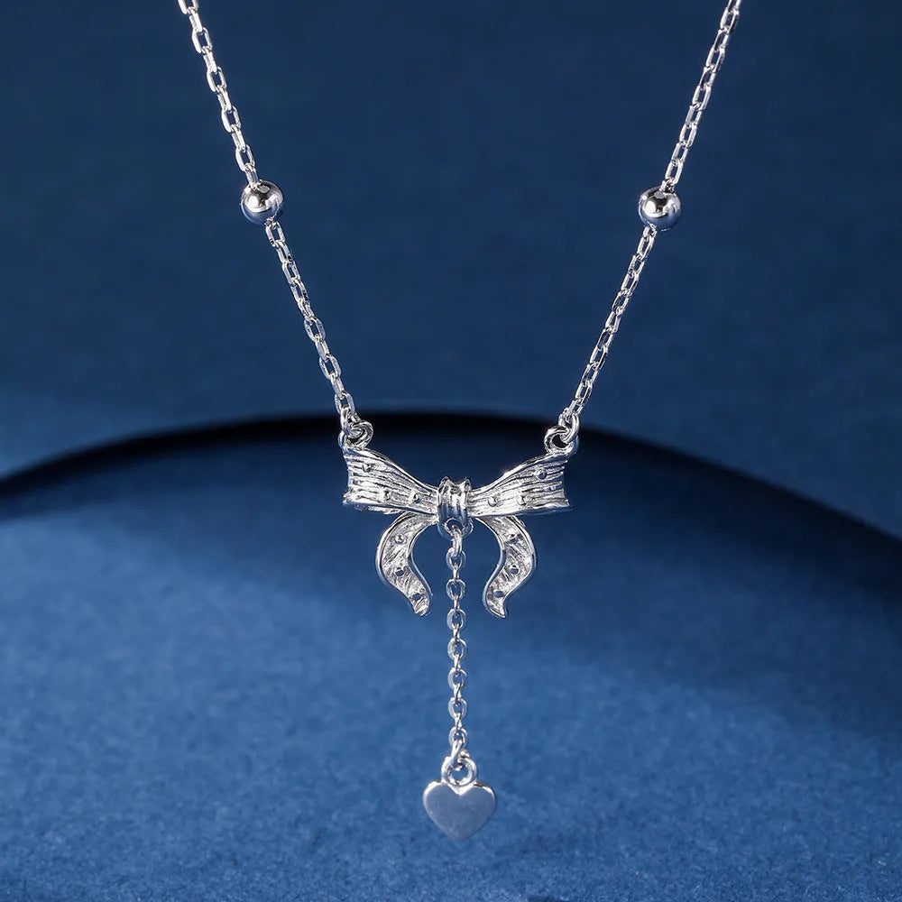 925 sterling silver necklace with a detailed butterfly and heart-shaped pendant on an adjustable O-ring chain.