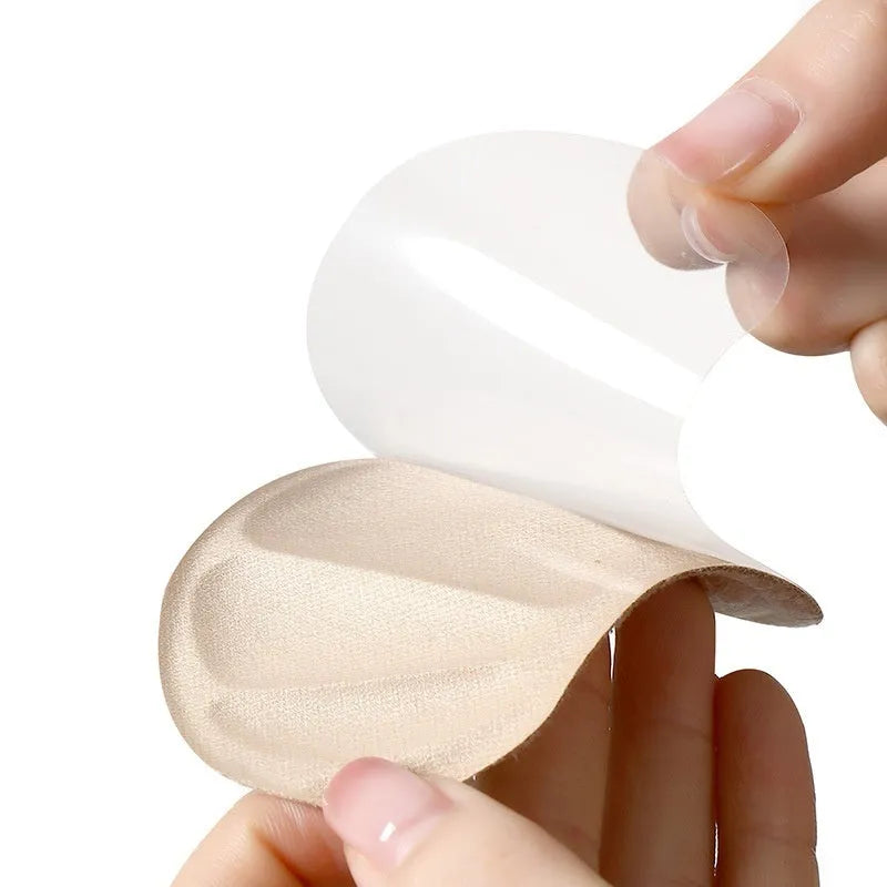 Three pairs of camel-coloured suede anti-slip heel cushion pads for sneakers.