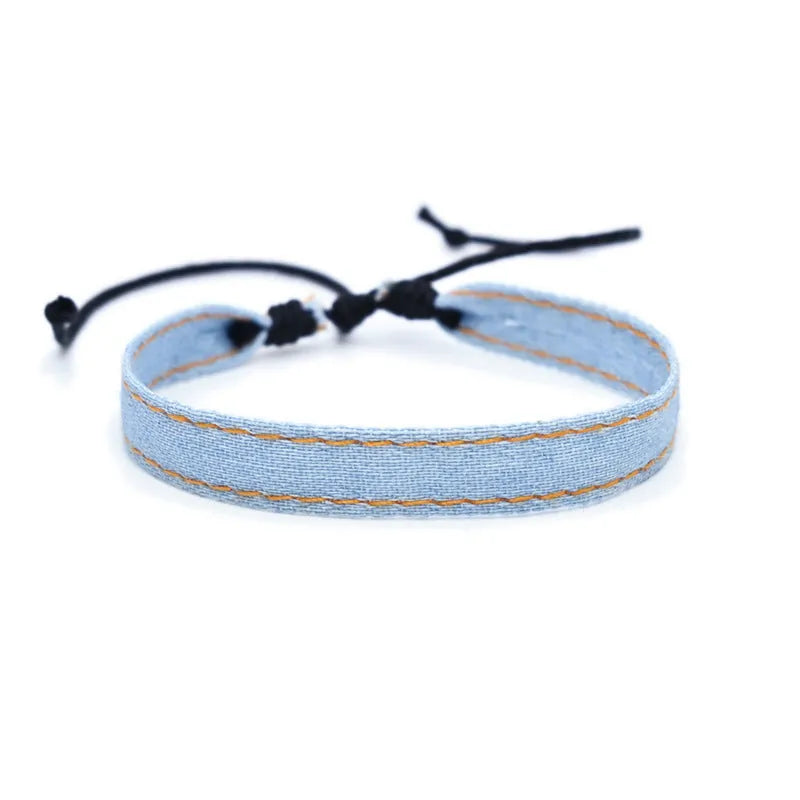 Denim fabric bracelet carrying strap with mixed materials, unisex design for travel