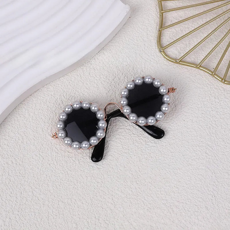 Pearl-rimmed round sunglasses for pets on cat and dog with black, blue, coffee, orange and purple colour options