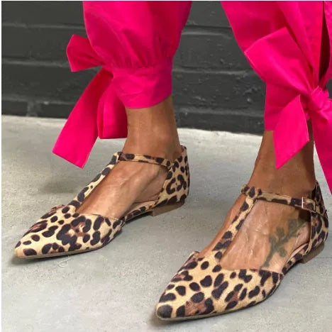 Leopard print women's pumps with pointed toe, chunky low heel, and ankle strap in PU material