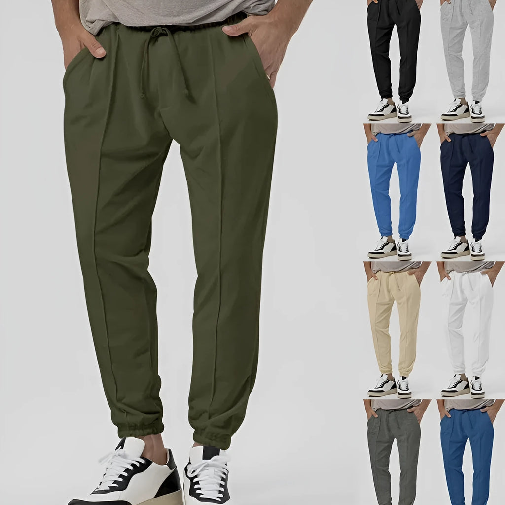Men's loose tapered casual track sweatpants in cotton blend fabric showing straight-leg design