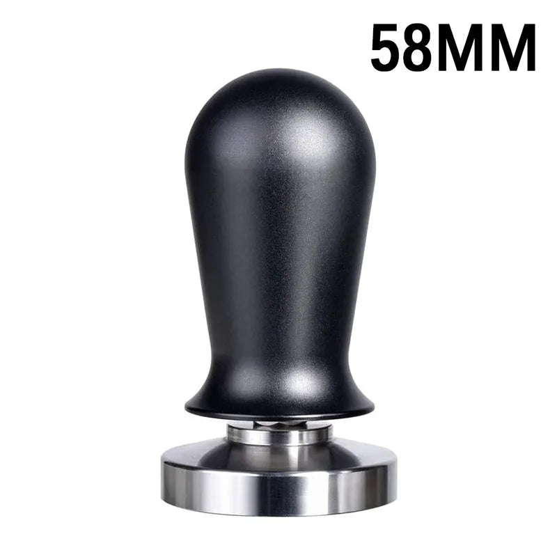 Black silicone coffee tamper pad with stainless steel base for non-slip espresso preparation