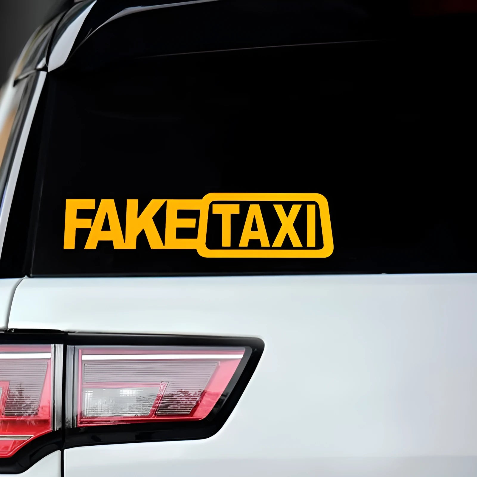 FAKE TAXI car warning sticker in yellow, black and white colour options measuring 20 by 8 centimetres