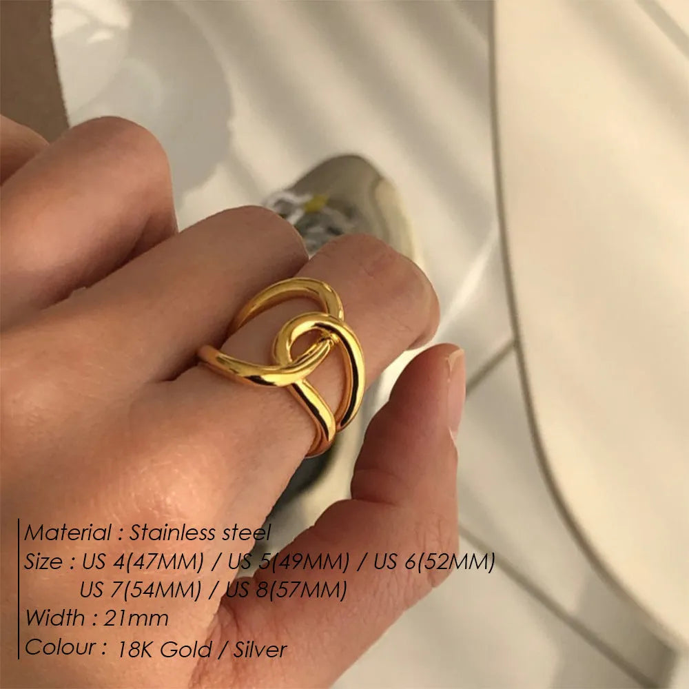 Women's stainless steel adjustable opening ring with a geometric knot design in gold colour.