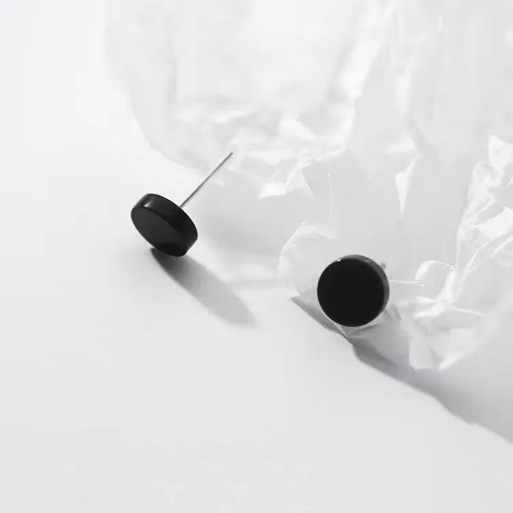 Sterling silver S999 flat ear bone stud earrings with round geometric design in silver and black colours