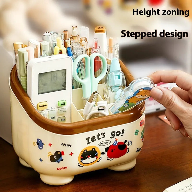 Cartoon-style red and brown plastic desktop storage box with grid compartments for organising pens and stationery.