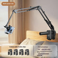 Metal cantilever bracket bedside table with four clips holding a mobile phone