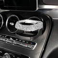 White rhinestone-decorated car cup holder bracket mounted on a car air vent