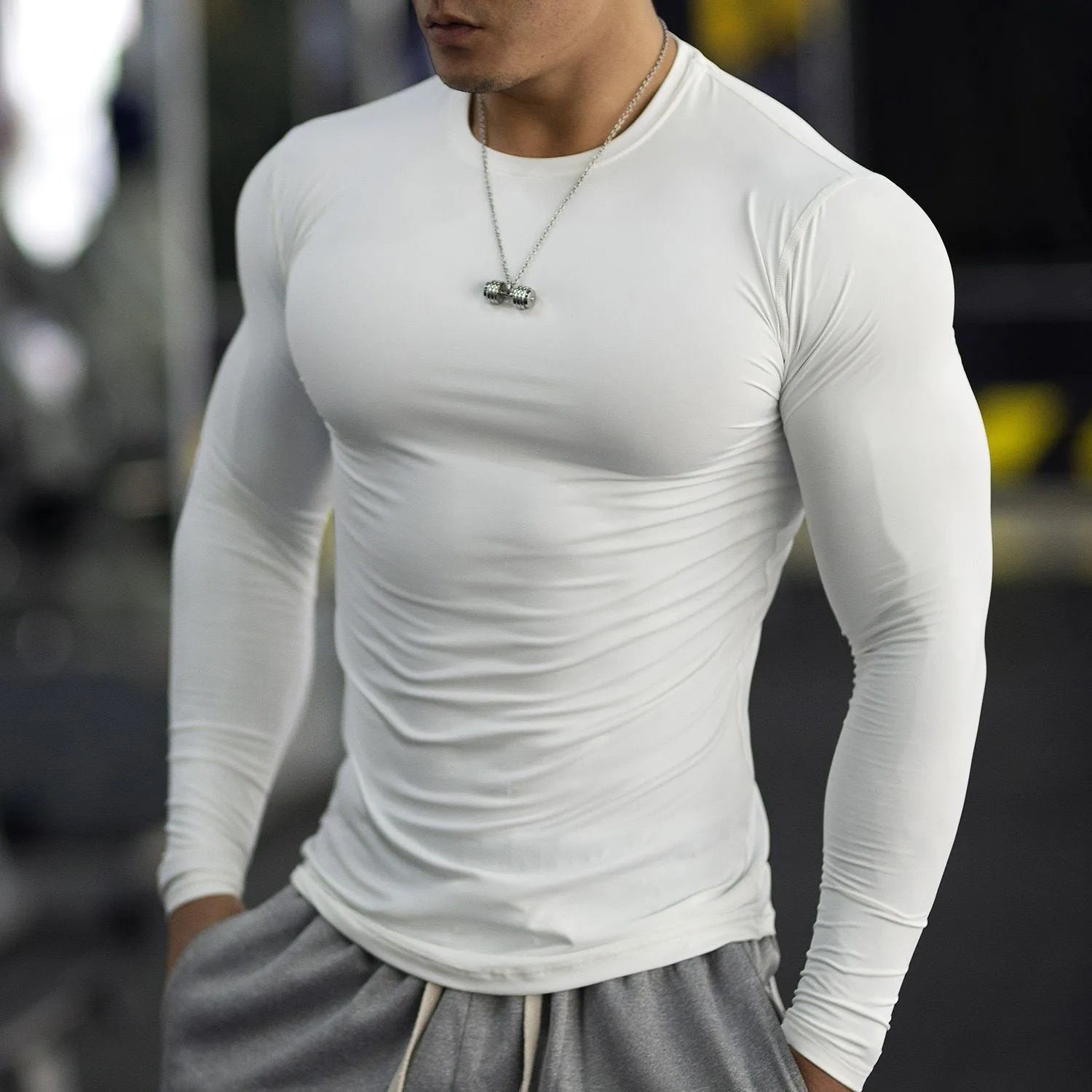 Men's black slim fit long sleeve fitness tights for running and gym workouts