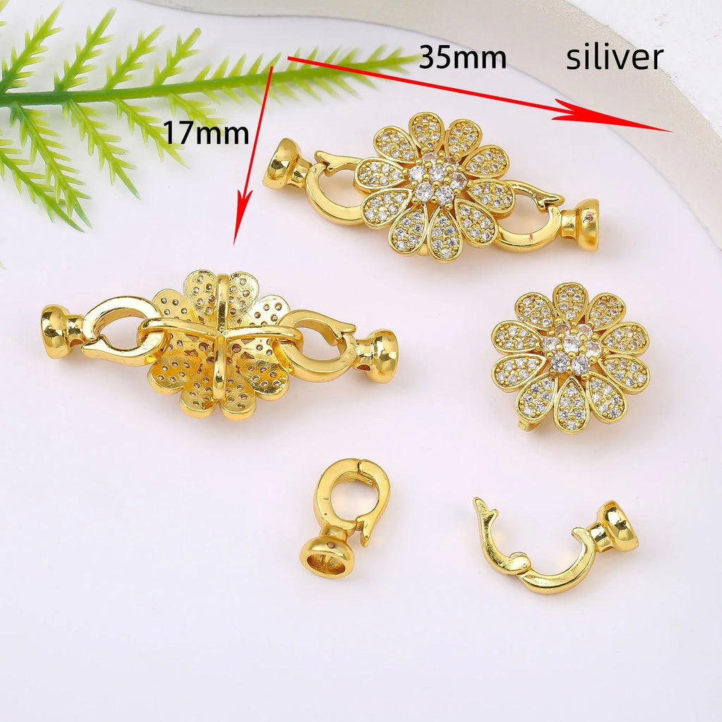 Small gold plated buckle clasp for DIY jewellery making on a white background.