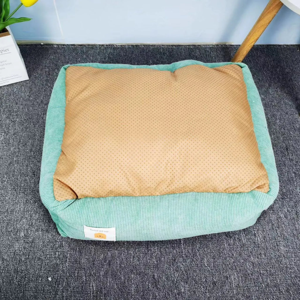 Light blue washable cotton pet winter nest for dogs and cats on a floor.