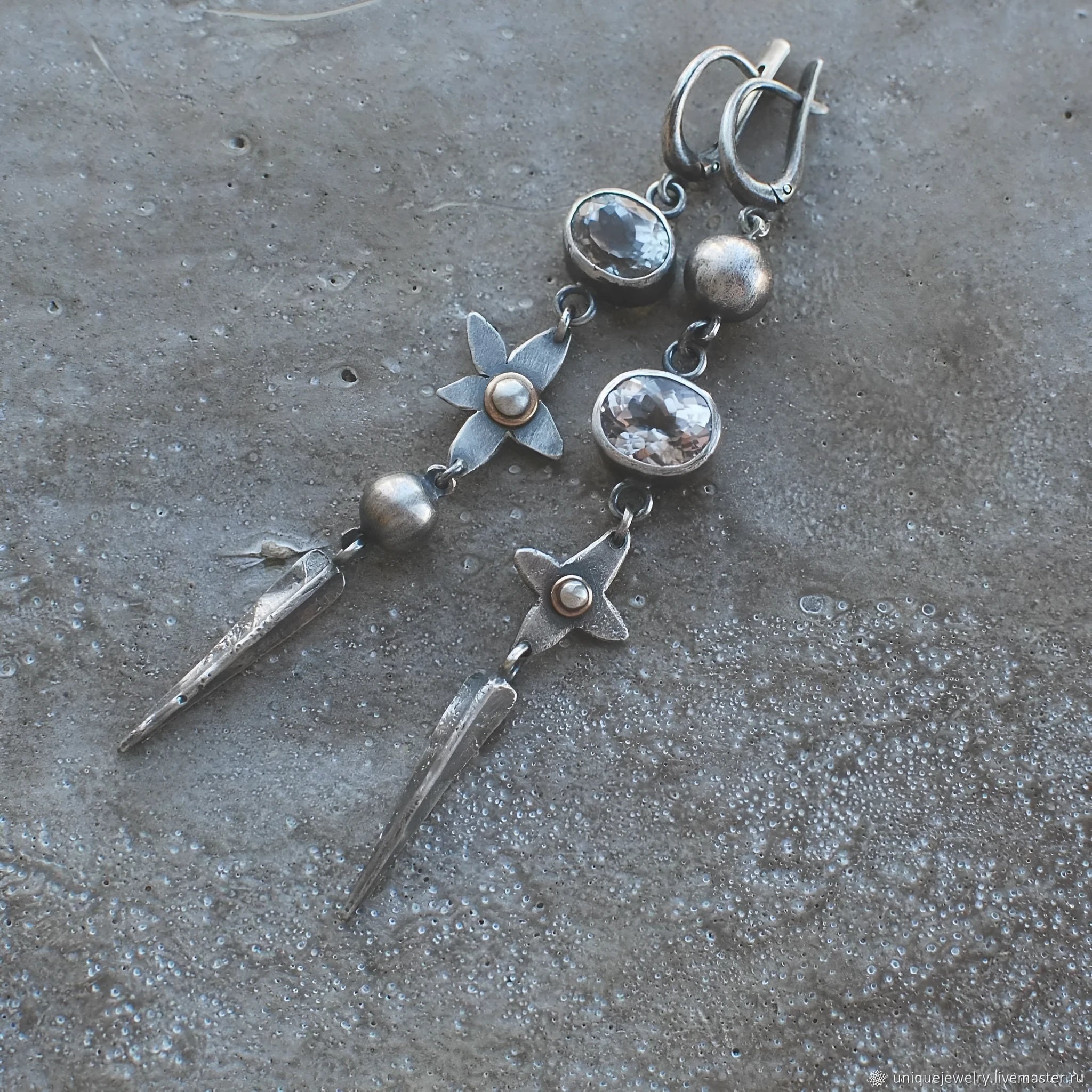 A pair of long geometric XINGX pendant earrings in antique silver with rhinestones.