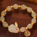 Women's green lucky jade hare bracelet with black elasticated cord