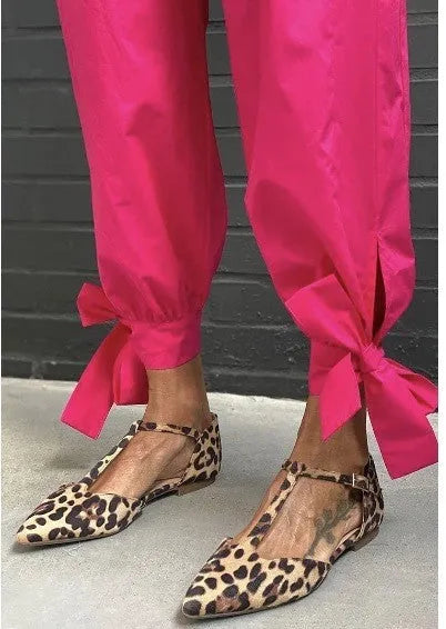 Leopard print women's pumps with pointed toe, chunky low heel, and ankle strap in PU material