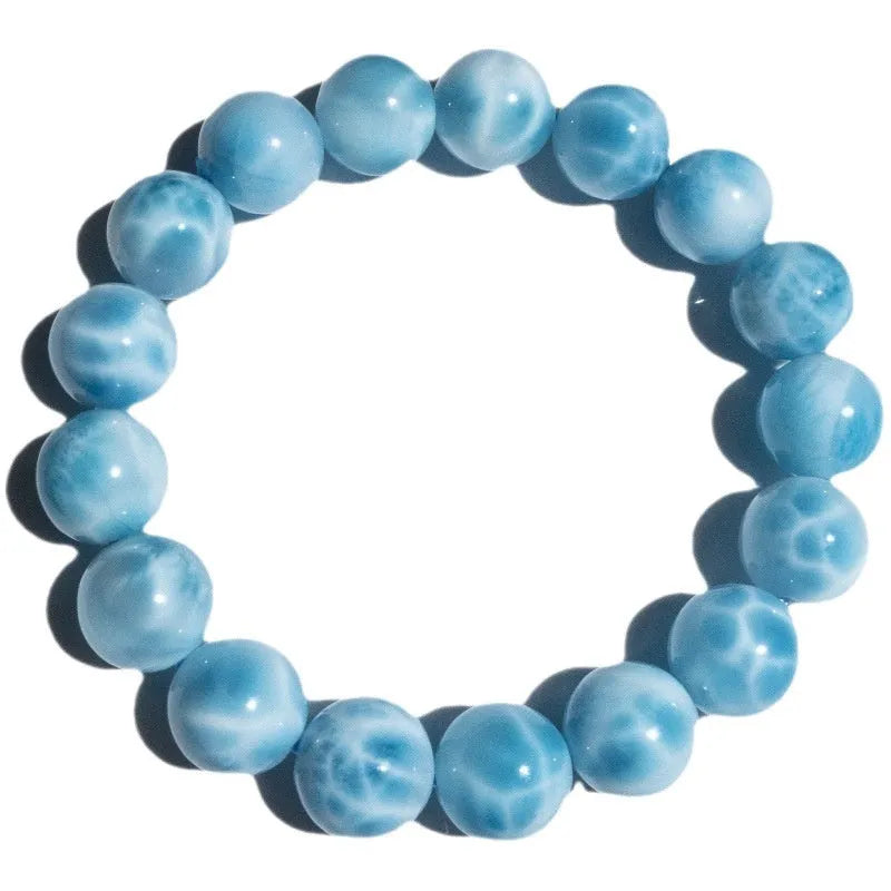 Blue handmade bodhi bracelet with natural crystal sea-pattern stone and pearl beads in Maillard style.
