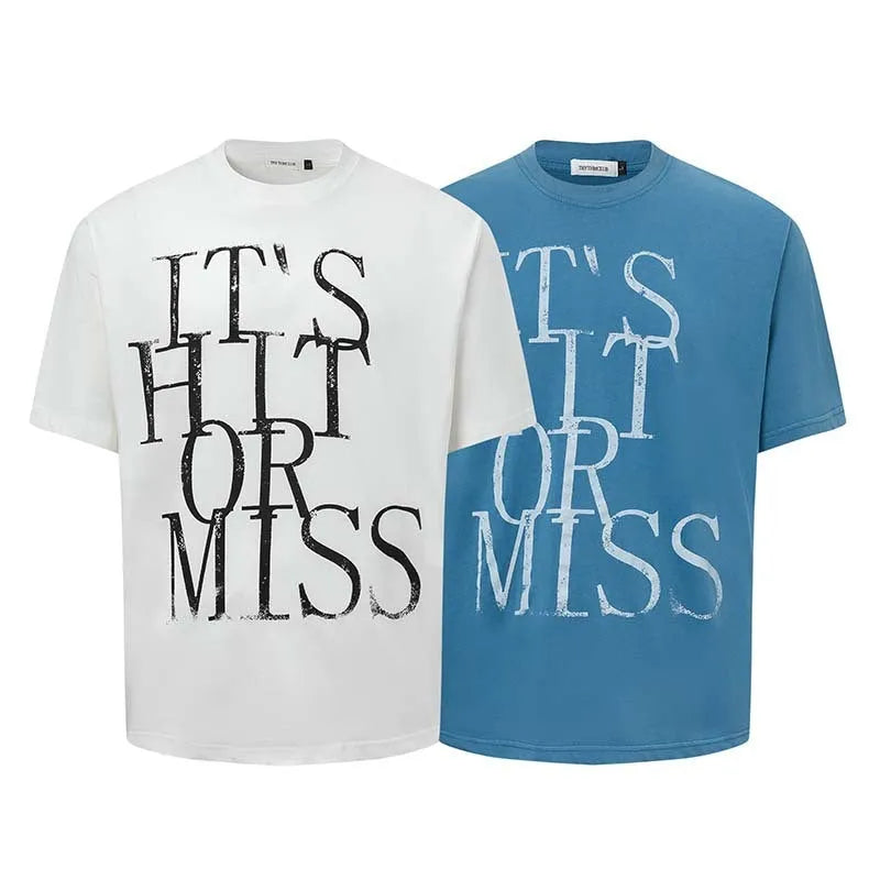 Man wearing a blue loose-fit American retro t-shirt with a white letter print design.