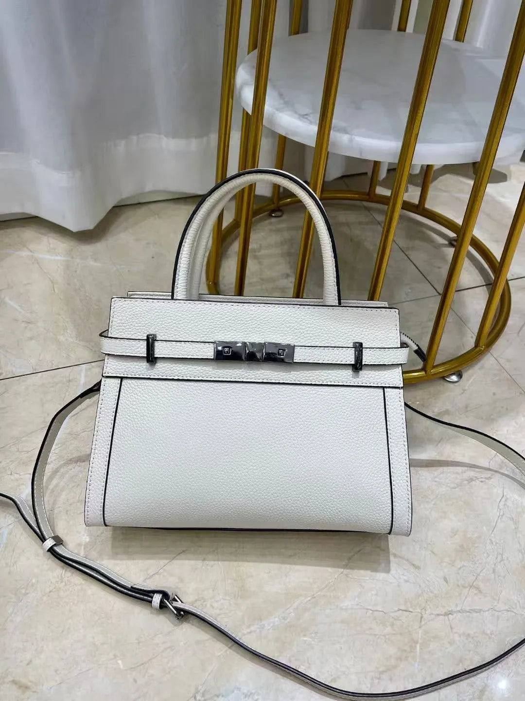 Genuine leather small square shoulder bag in almond green colour showing internal compartments